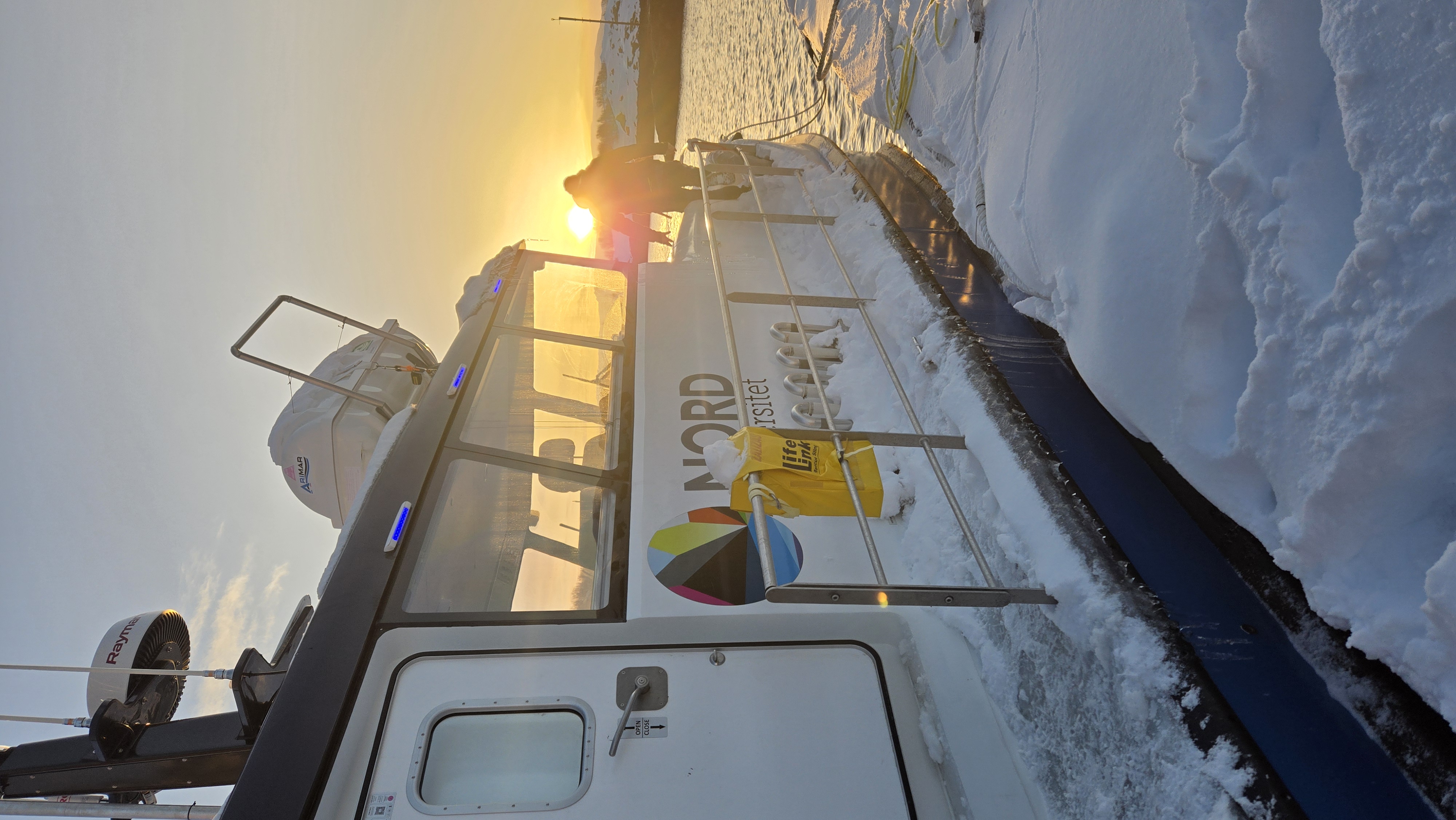 Boarding research boat to go sampling in winter sub-arctic